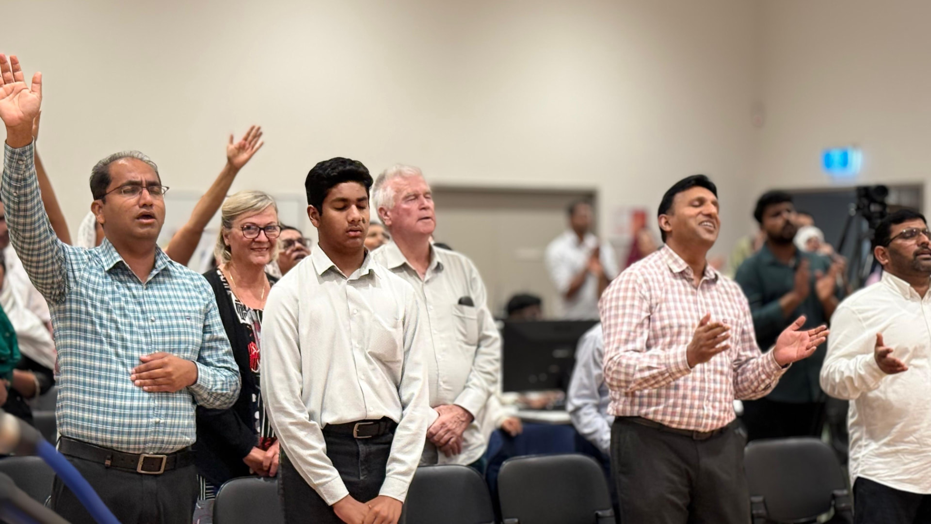Members of the fellowship in worship